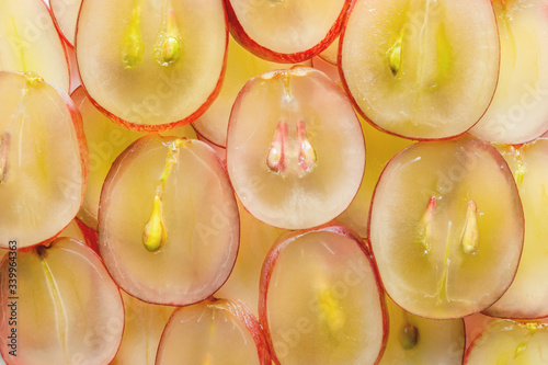 top view of transparent red green grape slices with seeds