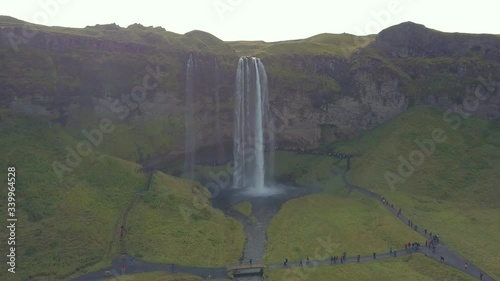4K aerial footage of amazing waterfalls in South Iceland known as Seljalandsfoss Waterfall during summer season.
