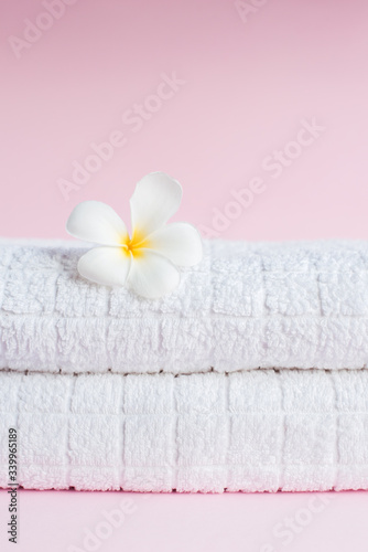 SPA White pluneria flower on white towel
