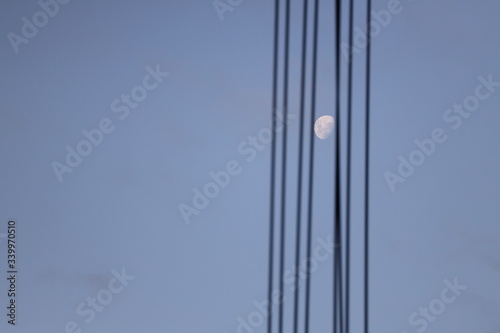 the moon between the cables