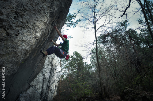 Climber on an overhanging wall, very hard route, Laboratorium, Jura, Polska