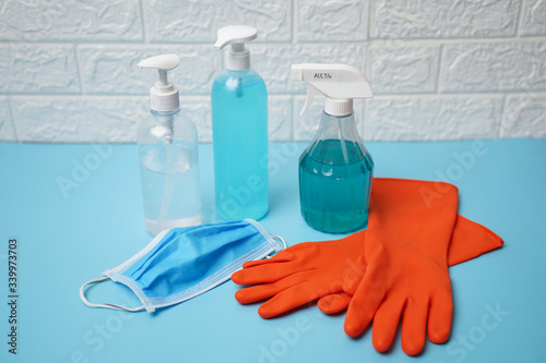 Coronavirus prevention travel surgical masks, Rubber gloves, hand sanitizer gel and spray for hand hygiene spread protection. photo