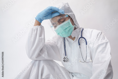 Medical worker in protective suit has stress in Coronavirus outbreak. Emotional stress of overworked medical care team..Concept prevention Covid-19 outbreak.