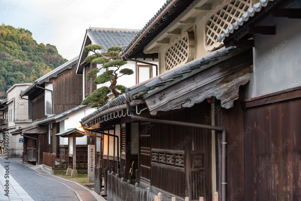 Takehara Townscape Conservation Area in dusk. The streets lined with old buildings from Edo, Meiji periods, a popular tourist attractions in Takehara city, Hiroshima Prefecture, Japan