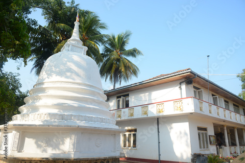Hikkaduwa, Sri Lanka - March 11, 2019: Religious monument near Akurala railway station photo