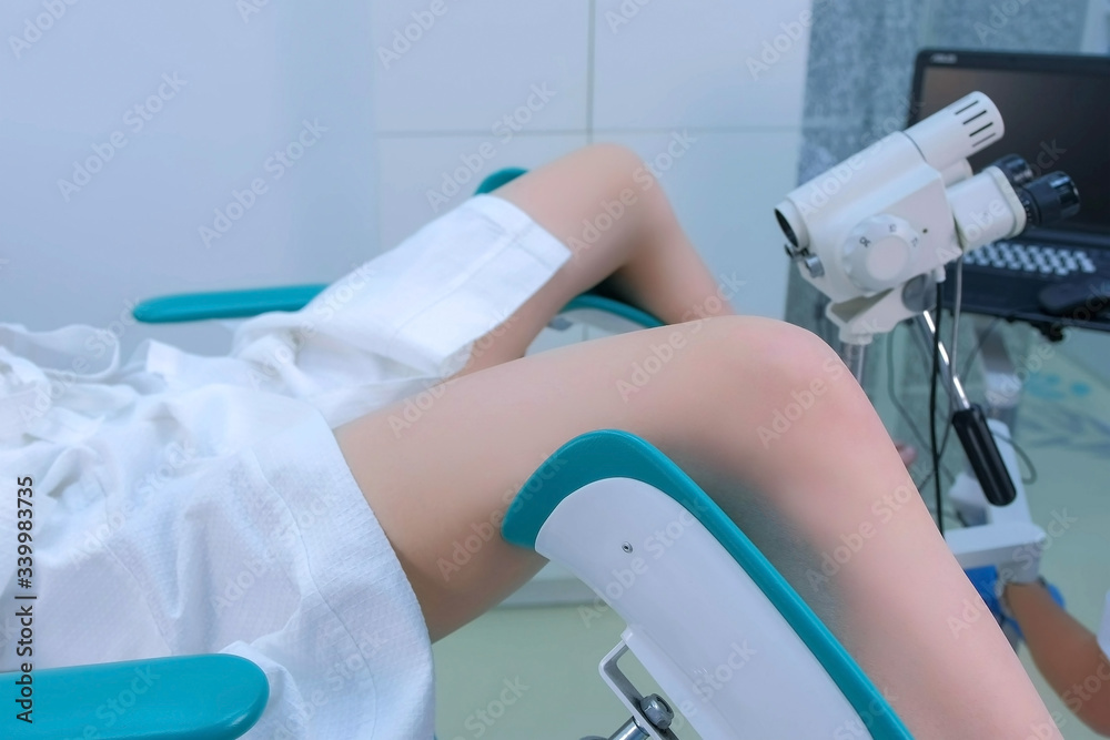 Patient and doctor in gynecological office on colposcopy procedure ...