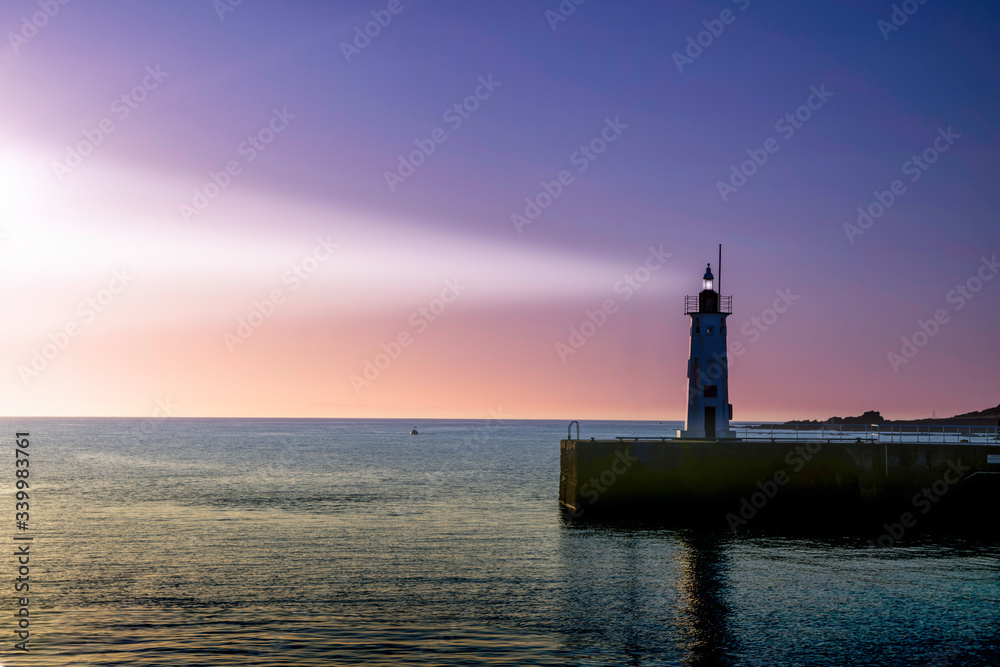 lighthouse view at Anstruther, fife, Scotland with beam of light from lighthouse.