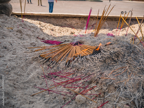 Close up burning Joss stick in joss stick pot on Xuanwu Mountain or yuanshan temple at Lufeng city guangdong provice china. photo