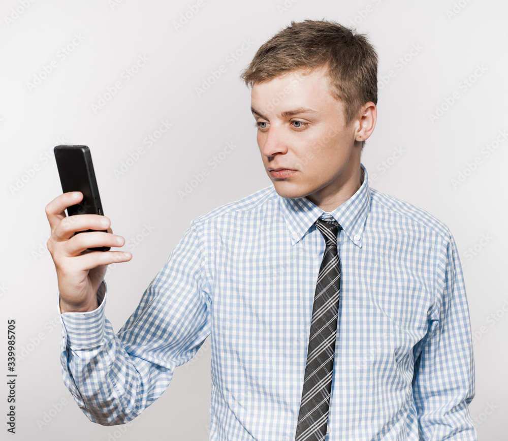 Business executive texting on his cell phone Business executive texting on his cell phone