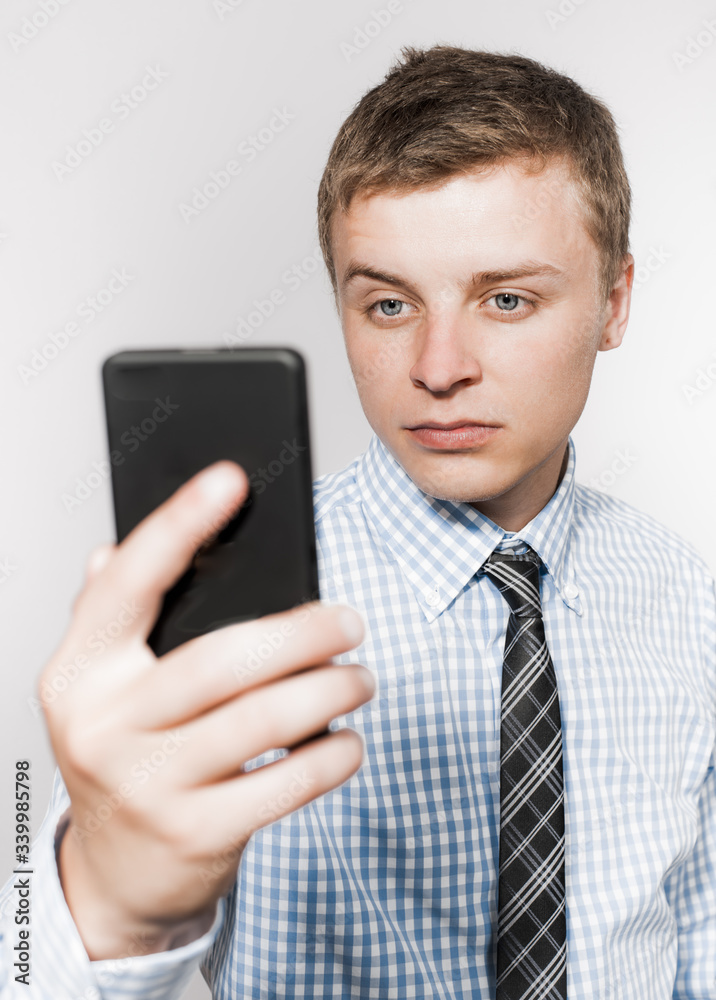 Business executive texting on his cell phone Business executive texting on his cell phone