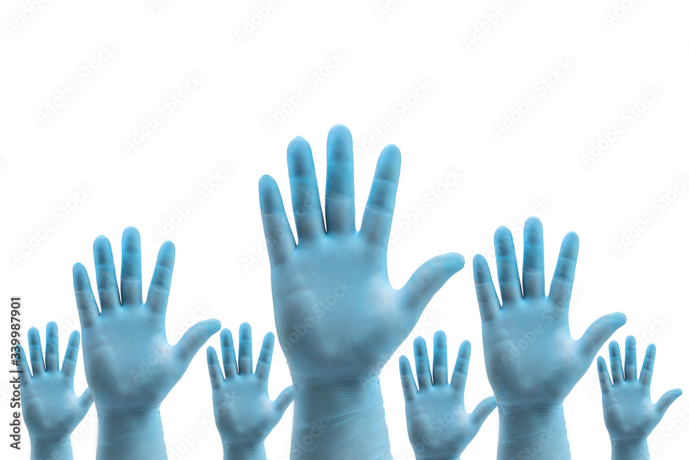 Hands in medical blue latex protective gloves on white background held up as a stop disease sign Hands in medical blue latex protective gloves on white background held up as a stop disease sign