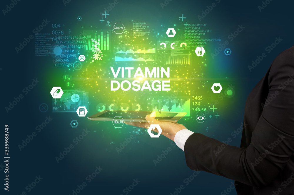 Close-up of a touchscreen with VITAMIN DOSAGE inscription, medical concept Close-up of a touchscreen with VITAMIN DOSAGE inscription, medical concept