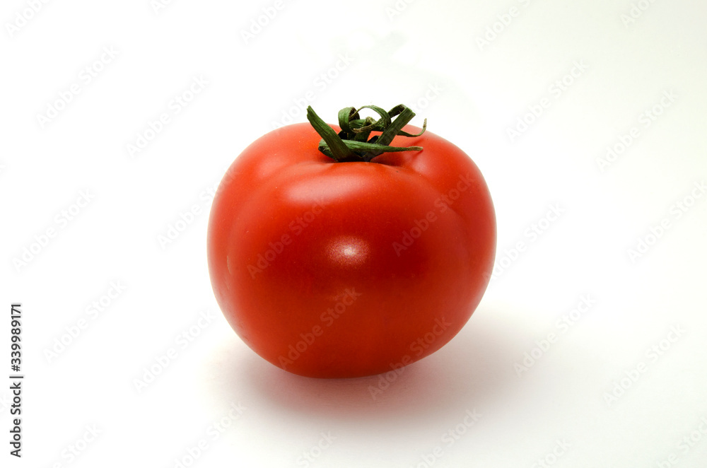Whole red tomato photo on a white background Whole red tomato photo on a white background