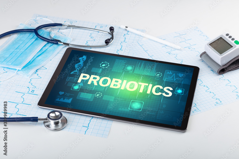 Tablet pc and medical stuff with PROBIOTICS inscription, prevention concept Tablet pc and medical stuff with PROBIOTICS inscription, prevention concept