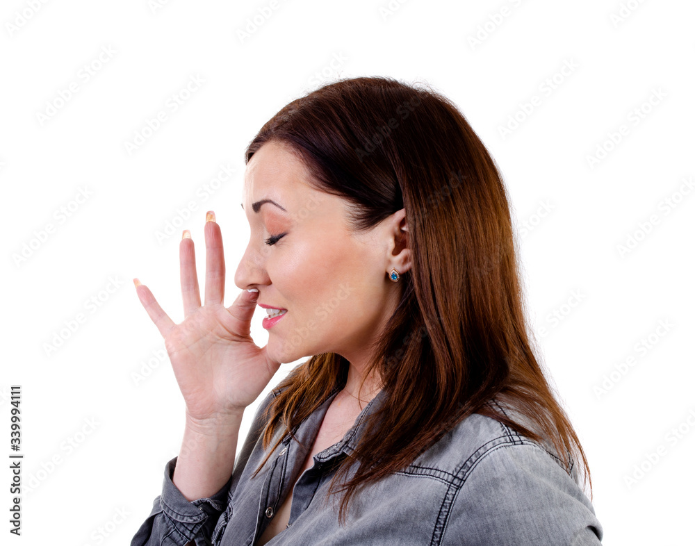 Young woman sneezes on a white background Young woman sneezes on a white background