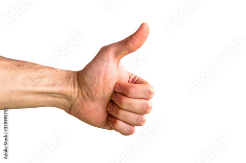 Men's hand thumb up, Business concept.Hand on a white background.Shows the class. Thumbs up.