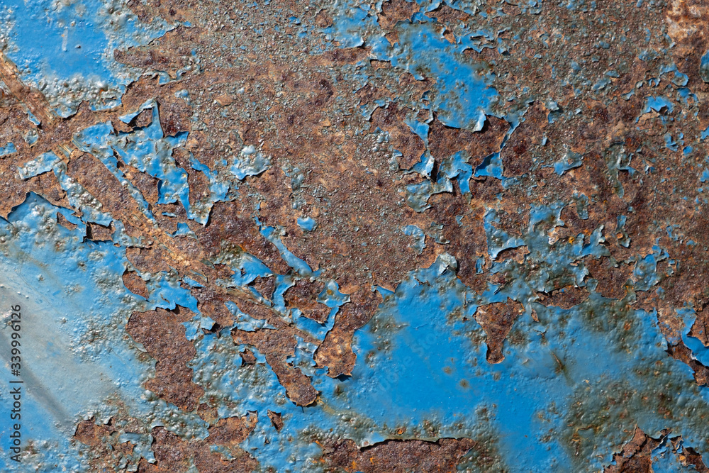 Fototapeta premium shabby, blue dried paint on the old rusty iron