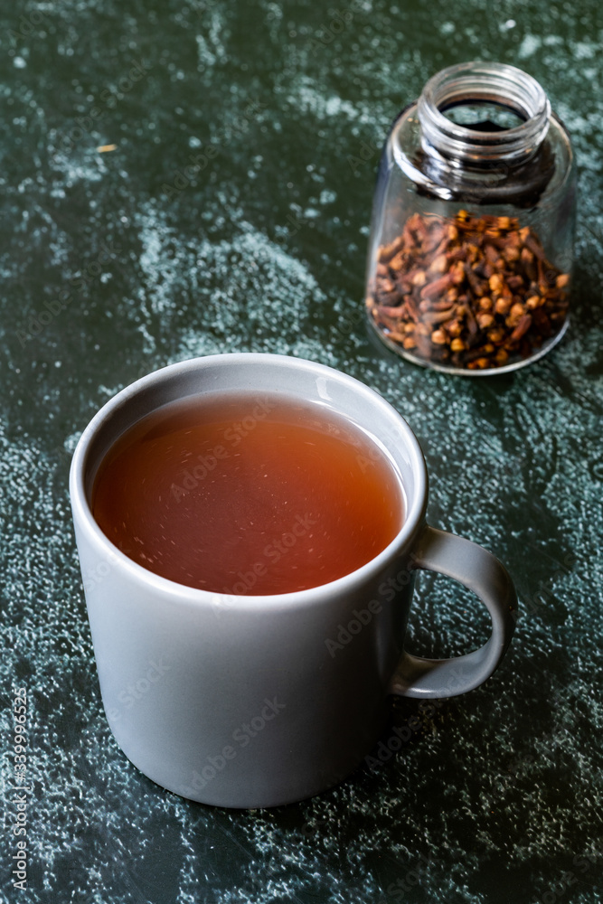 Sumac water or tea and dried ground red Sumac spices with cloves in glass. Sumac water or tea and dried ground red Sumac spices with cloves in glass.