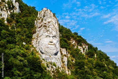 The face of the Dacian king Decebal is a 55 m high bas-relief located on the rocky bank of the Danube, between the towns of Echelnita and Dubova, near the city of Orsova, Romania. photo