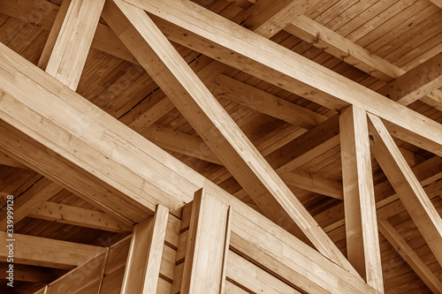 The construction of the wooden roof. Detailed photo of a wooden roof overlap construction. photo
