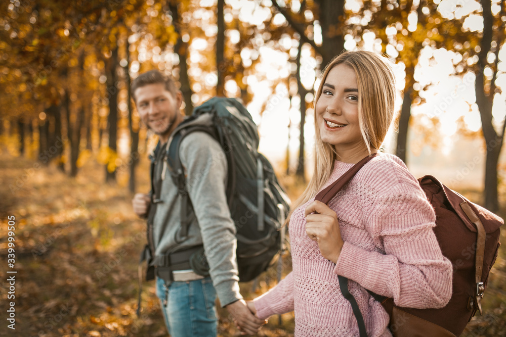 Happy Travelers Walking An Autumn Forest Path Outdoors Happy Travelers Walking An Autumn Forest Path Outdoors
