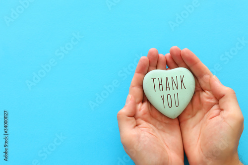 top view image holding heart with the text thank you photo