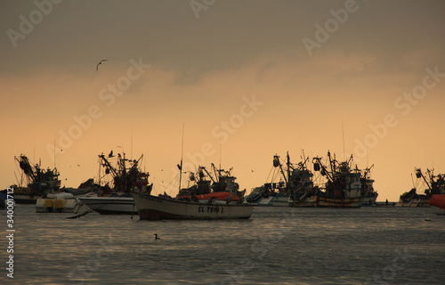fishing boats at sunset