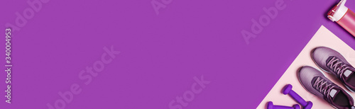 Sports equipment for women's training. Pink-purple web banner, diagonal composition.