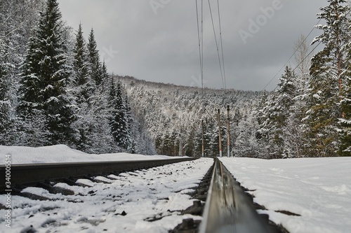 snow coniferous trees in the mountains of the Urals on top of mount aigir. photo