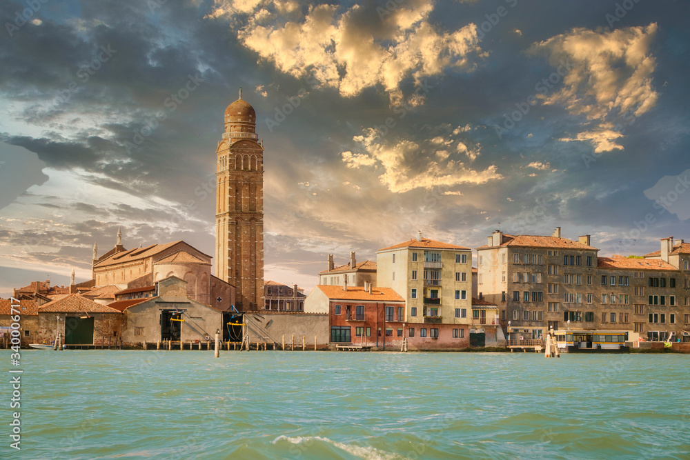 The bell tower of the church of San Pietro Martire in Venice at sunset.