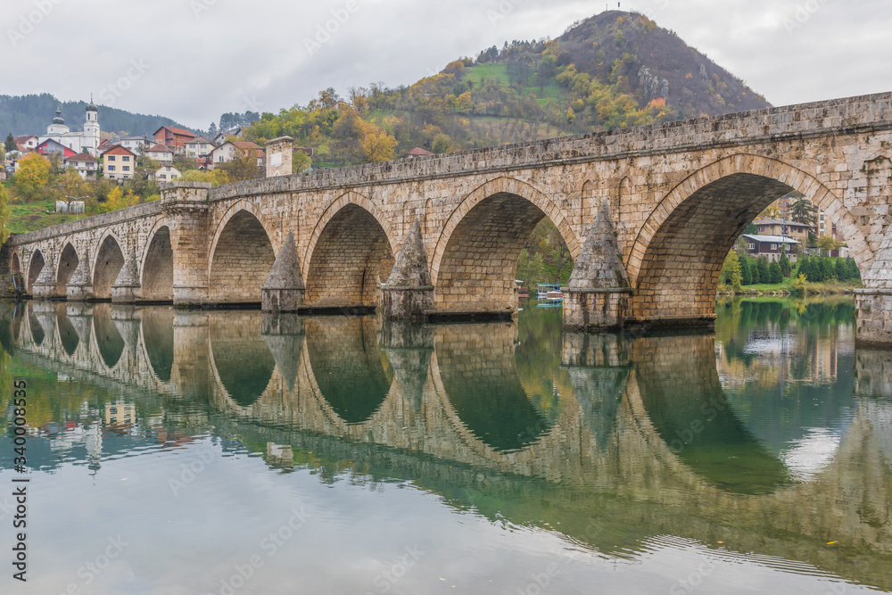 Fototapeta premium Visegrad, Bosnia & Herzegovina - the Mehmed Paša Sokolovic Bridge is one of the main landmarks in the country, and Visegrad one of the pearls of the Balkans