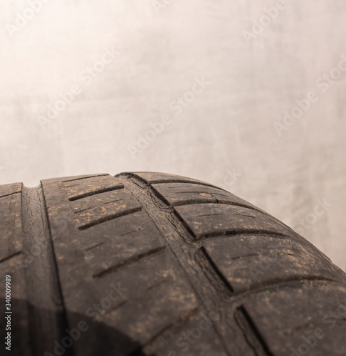 A self-tapping screw is inserted from the tire of the wheel. A punctured car wheel on a tire fitting.