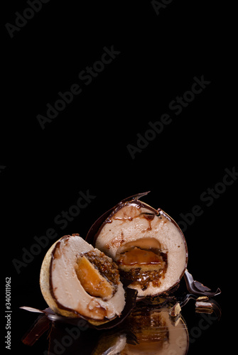 Pie nut, with nut cream, chocolate glaze sprinkled with gold photo