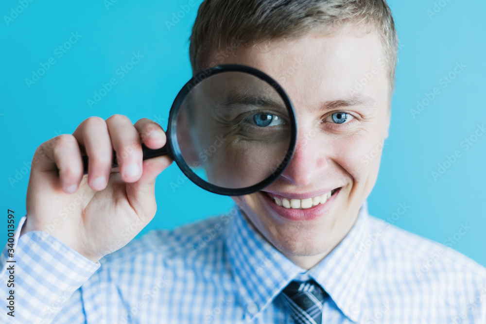 businessman with a magnifying glass businessman with a magnifying glass