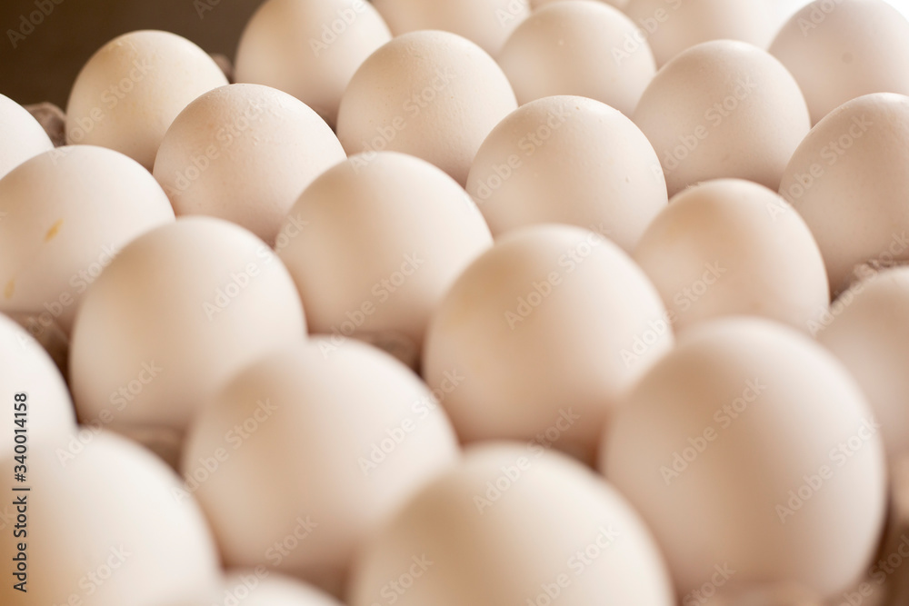 Fresh organic white eggs on the kitchen table - egg carton Fresh organic white eggs on the kitchen table - egg carton