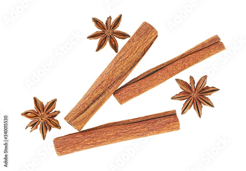 Fototapeta Naklejka Na Ścianę i Meble -  Cinnamon sticks and star anise spice isolated on a white background, top view.