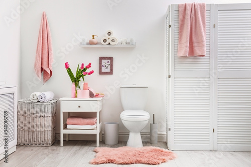 Interior of stylish bathroom with toilet bowl and decor elements #340016789