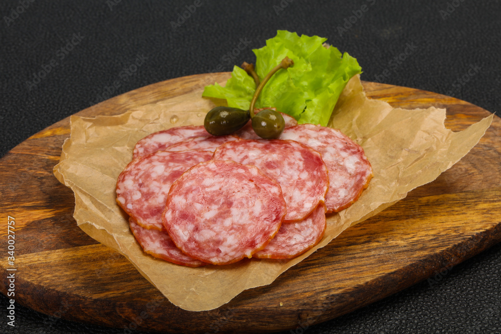 Spanish Salchichon sausage with salad Spanish Salchichon sausage with salad