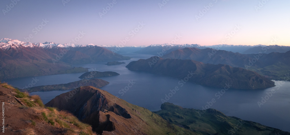 View on lake and mountain summit just before sunrise, shot made on Roys Peak in Wanaka, New Zealand