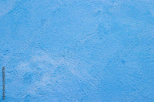 The texture is a patched wall . Blue texture of the wall. Abstract background. .