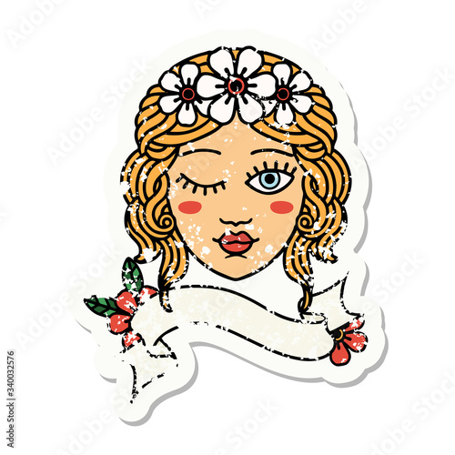 grunge sticker with banner of a maidens face winking
