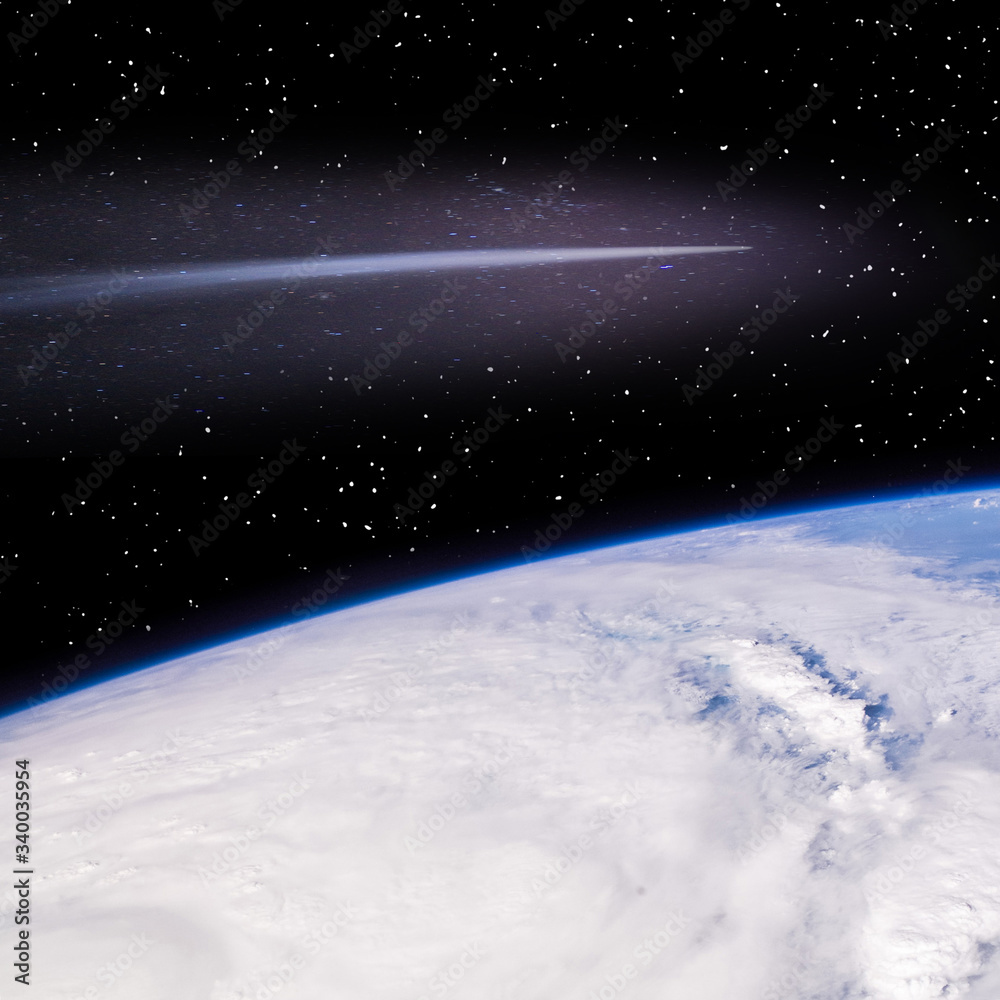 Comet flying above the earth. The elements of this image furnished by NASA. Comet flying above the earth. The elements of this image furnished by NASA.