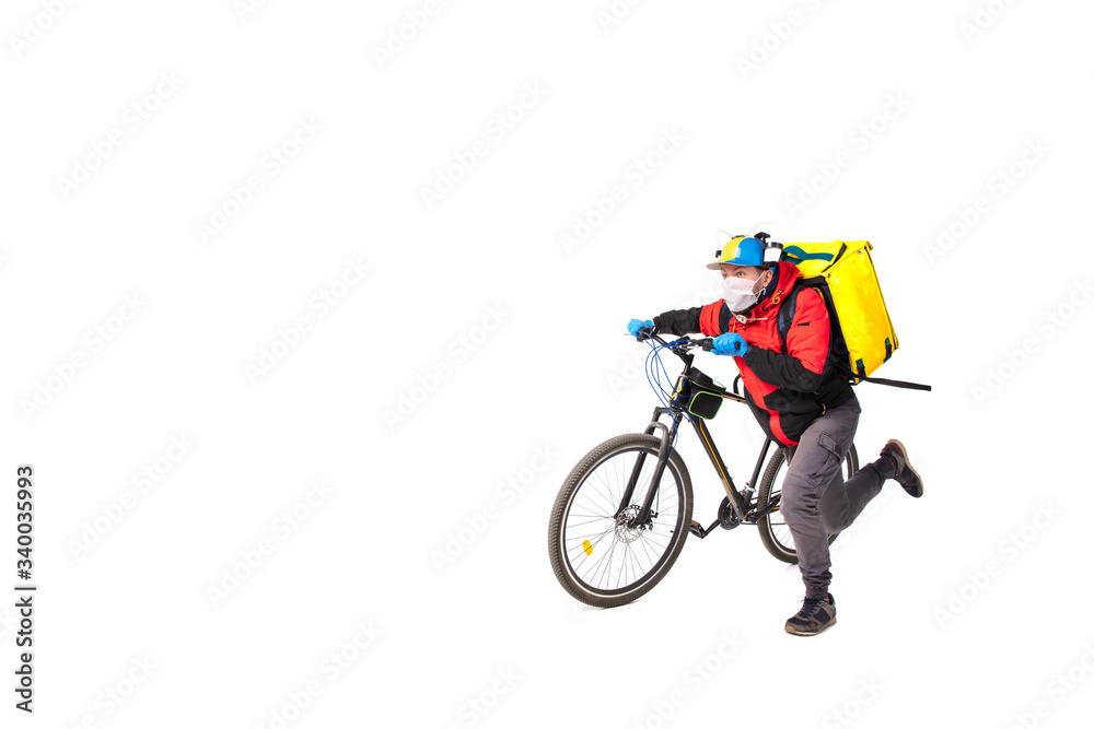 Obraz premium Too much orders. Contacless delivery service during quarantine. Man delivers food during isolation, wearing gloves and face mask. Taking pizza on bike isolated on white background. Safety. Hurrying up