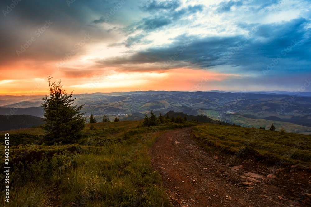 scenic summer sunset landscape, stunning sunrise scenery, green hill on background amazing sky, colorful summer evening landscape in the mountains, Carpathians, Europe, Ukraine