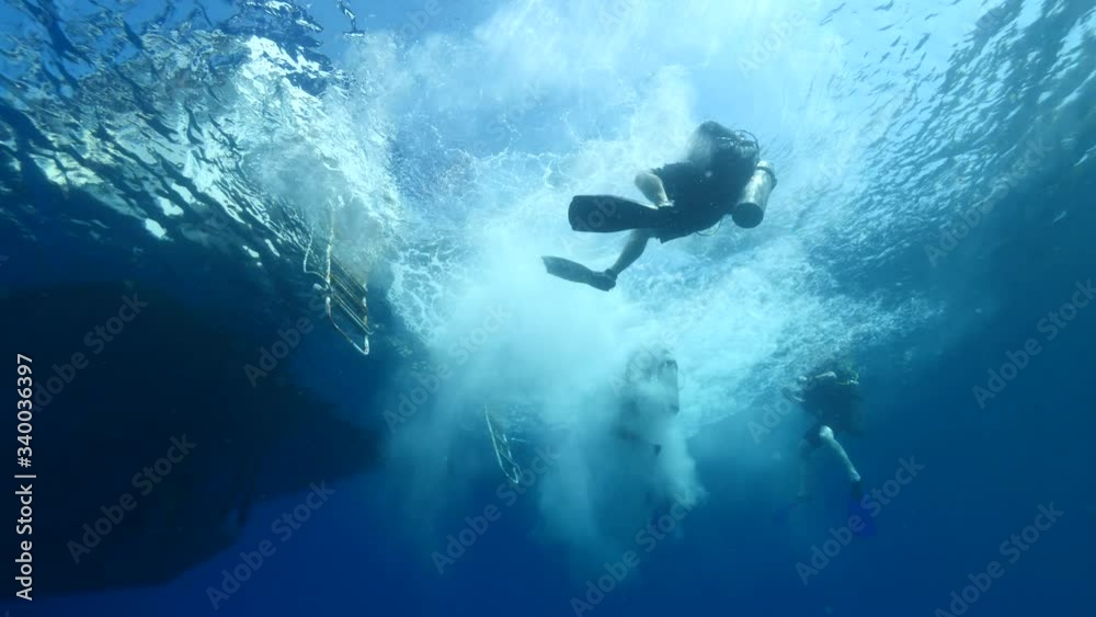 scuba divers jumping in water from boat underwater ocean scenery scuba divers jumping in water from boat underwater ocean scenery