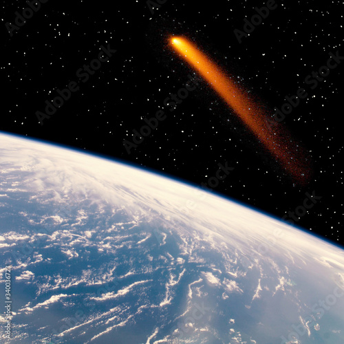 Fototapeta Naklejka Na Ścianę i Meble -  Comet over the earth. Meteor rain. The elements of this image furnished by NASA.
