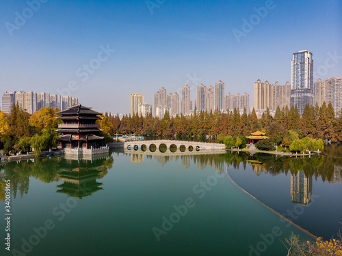 Panoramic view of the lake with a typical chinese temple and the new city above