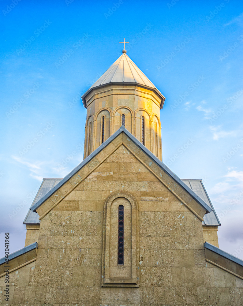 Temple of the Georgian Orthodox Church on a background of blue sky
