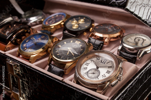 storage box with collection of men wrist watches photo