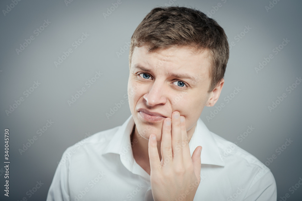 a young man with a toothache a young man with a toothache